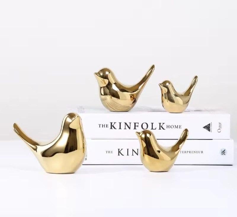 Artistic Birds - A trio of hand-finished porcelain figurines with gold accents, perfect for creating a peaceful atmosphere in yoga studios or quiet reading nooks, these durable ceramic pieces resist f
