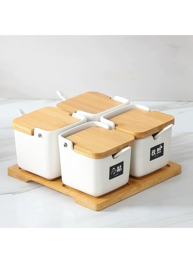 of 4 square ceramic spice jars with lids and spoon for storing salt, sugar and spices.