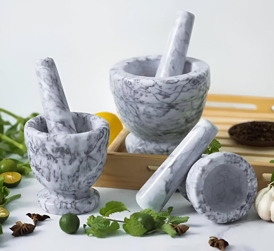 Mortar & Pestle - Natural Marble - This Essential Herb, Spices & Condiment Grinder Set is made of high-quality marble and granite, perfect for any cooking area (shown, 2 mortars and pestle)