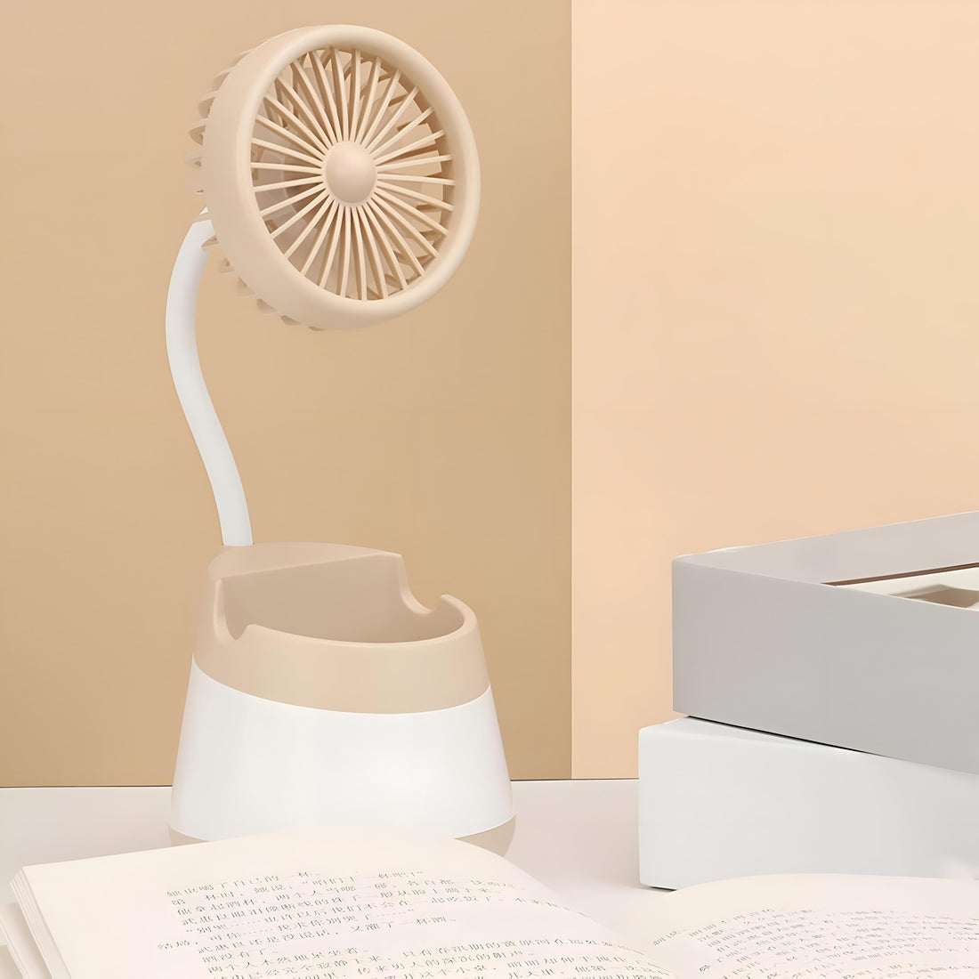 Desk Fan - Compact multi-purpose cooling device with sleek modern aesthetics and powerful airflow. It can be used as a smartphone holder, remote control stand or pen storage unit. Ideal for personal w