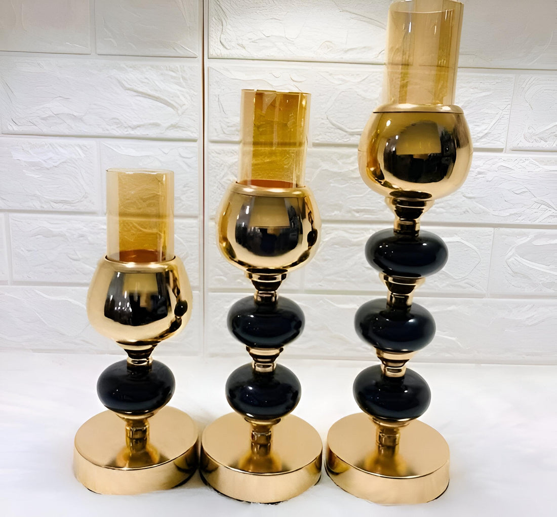Decorative Trio - Artistic metal candle stand collection featuring black stones, crafted for luxury interior styling, enhancing festive dinners, and creating warm candlelight atmosphere