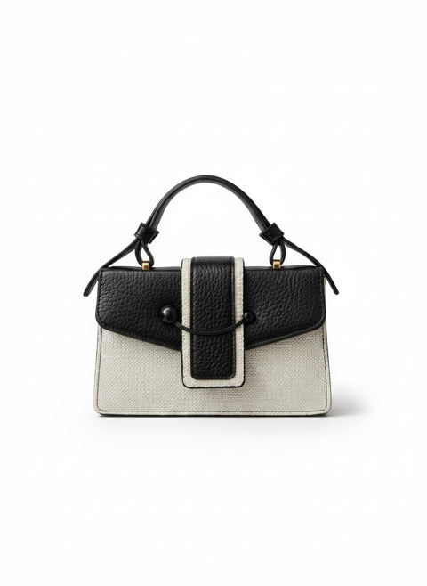 A stylish classic women's handbag, featuring a modern two-tone design in black and beige, with ideal dimensions of 22 x 14 cm, and made of high-quality faux leather.