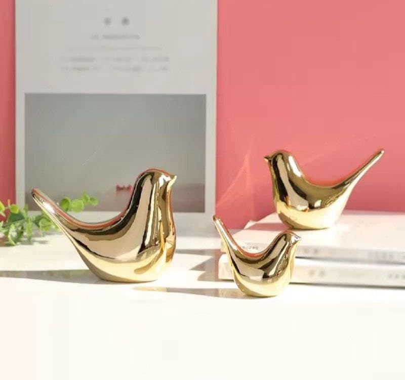 3 Birds Set - An elegant trio of porcelain sculptures painted with a metallic gold finish. Perfect pieces for modern apartments and offices, these durable ceramic artworks elevate your shelving layout