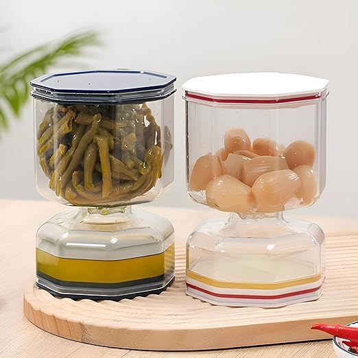 A jar of pickles and olives in the shape of an hourglas - 250ml airtight acrylic jar with a detachable strainer and foldable stainless steel spoon for easy storage