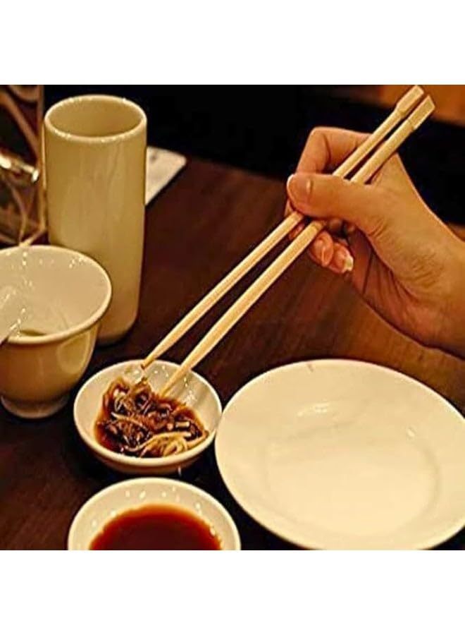 A set of 10 pairs of beautiful, reusable wooden chopsticks with a long design made of natural wood. Elegant, eco-friendly tableware, safe for everyday use in the kitchen.