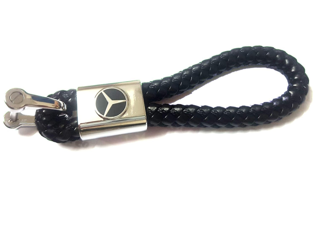 leather keychain with a metal piece embossed on it mercedes car logo with screwdriver to open the clasp