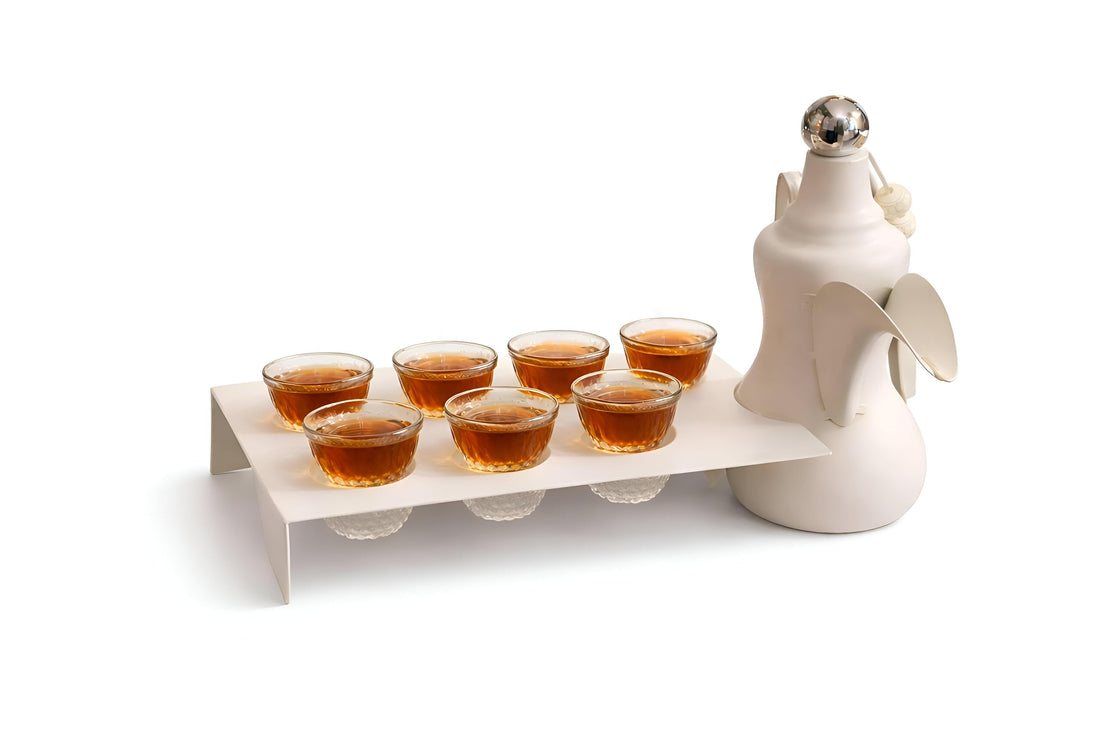 Dove Teapot - Handcrafted white ceramic teapot shaped like a graceful dove, detailed with subtle gold accents, paired with a polished serving tray and seven crystal‑clear glass cups, ideal for authent