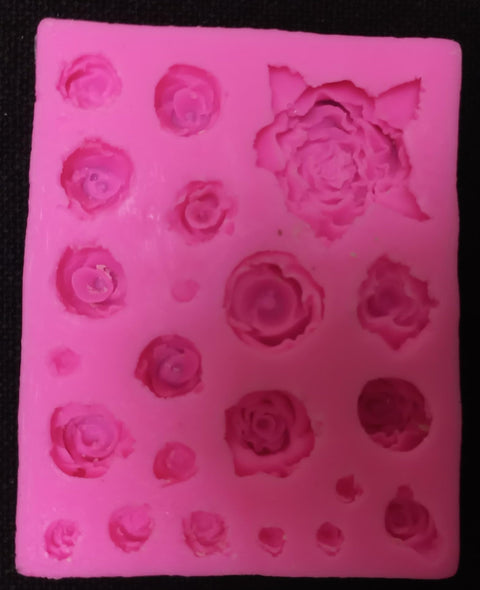 Pink Silicone Mold with Small Cavities in Assorted Flower Shapes, Multiple Rows Mold, Each Cavity Represents Different Flower Shape in Size and Details, This Type of Mold is Commonly Used in Artwork