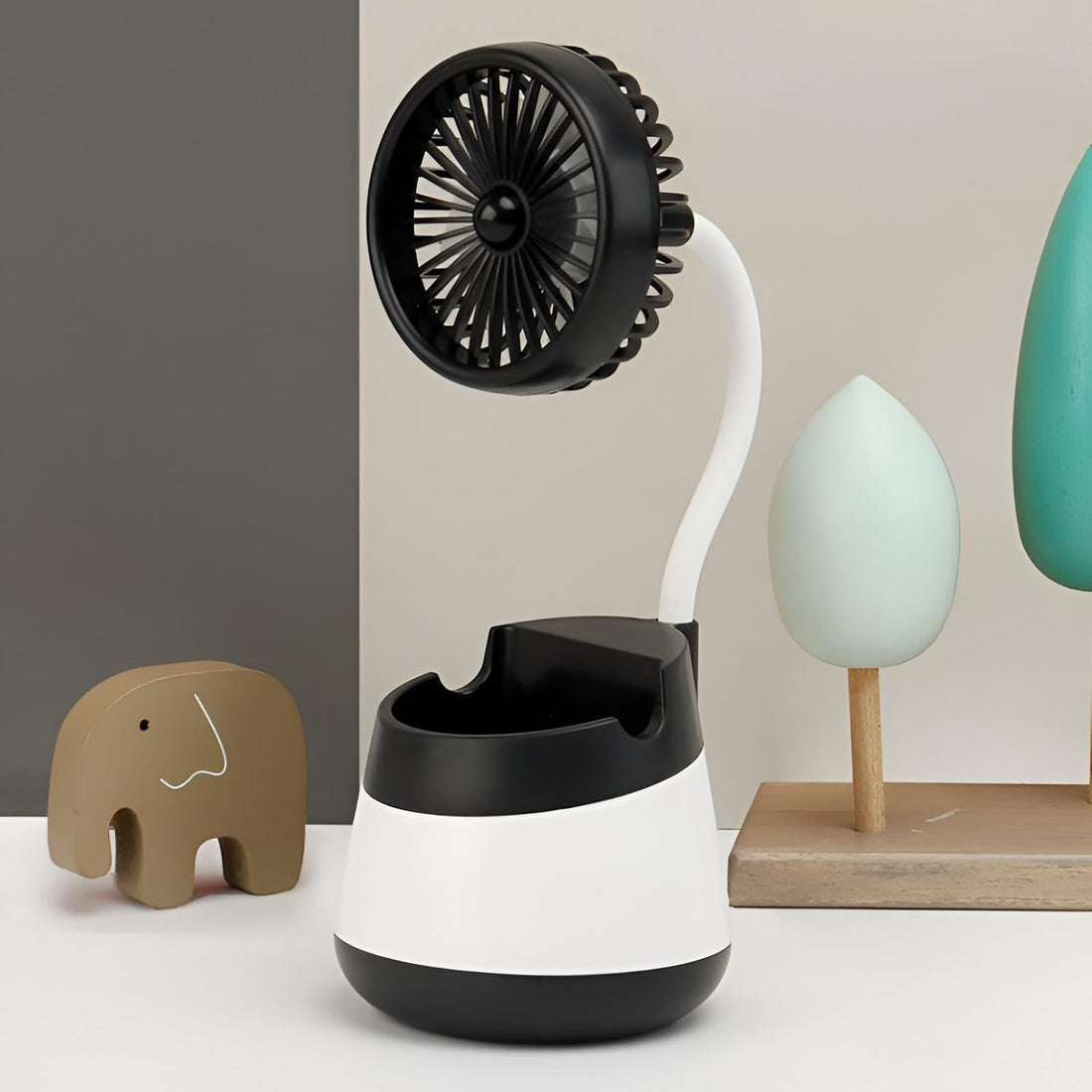 Air Diffuser - Compact multi-purpose fan with stylish modern design and powerful cooling output. Features built-in slots to hold phones, remotes or pens. Ideal for enhancing comfort in office and home