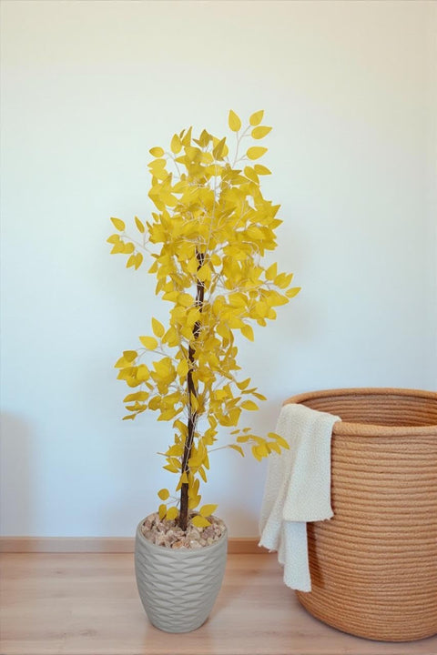 Realistic artificial tree - Leon Home artificial ornamental Benjamina plant, 145cm tall, for indoor and outdoor use, with a wooden trunk, plastic leaves, and decorative pebbles in a plastic pot - yell