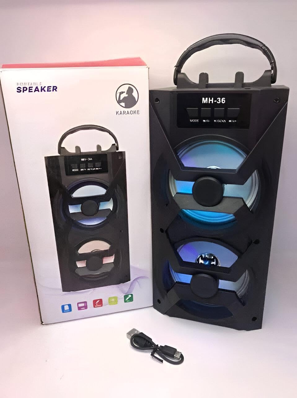 LED Bluetooth Speaker - Combines karaoke mode, FM radio, USB/AUX input, 1200mAh power, and stylish black finish in a portable 26x13cm frame for music lovers.