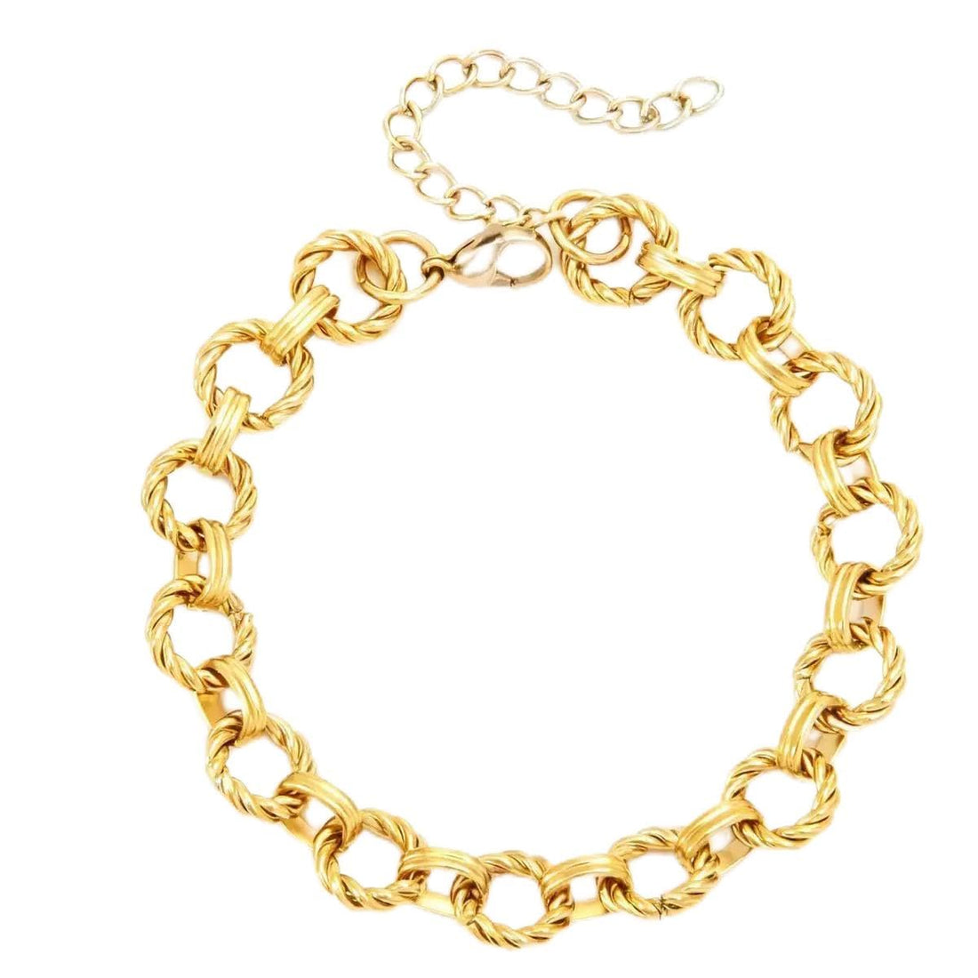 Make a statement: a stainless steel bracelet featuring bold, engraved gold rings.