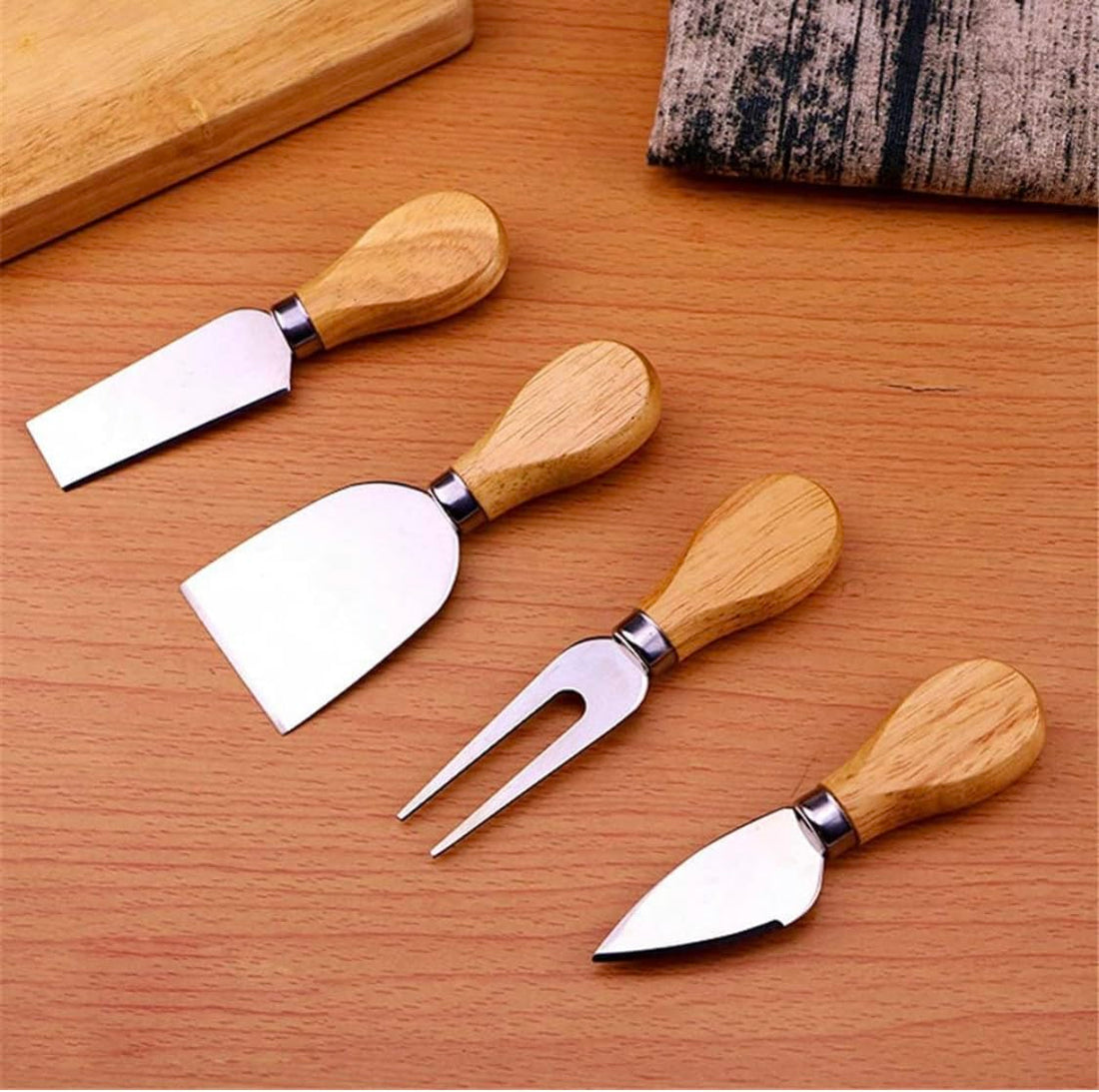 4PCS Cheese/butter Knife Set, Premium Stainless Steel Cheese Slicer and Cutter Collection with wooden Handle ‎مجموعة سكاكين الجبن/الزبدة من 4 قطع، المصنوعة من الفولاذ المقاوم للصدأ بمقبض خشبي